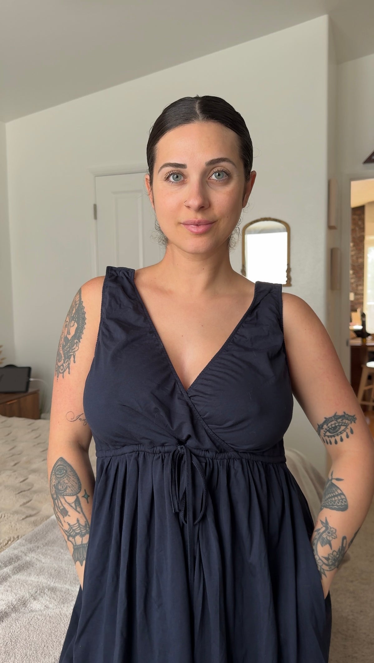 Mom wearing the Baby Bliss Amora wrap labor gown in black